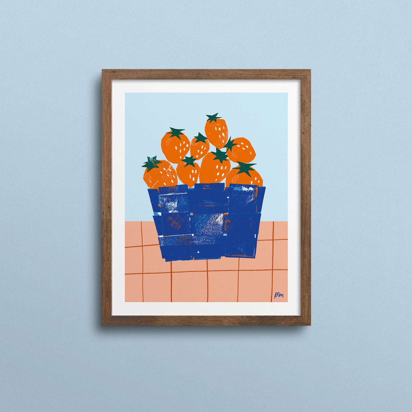Fresh strawberries nestled in a blue basket print, vibrant orange berries with green stems on pink tiled counter