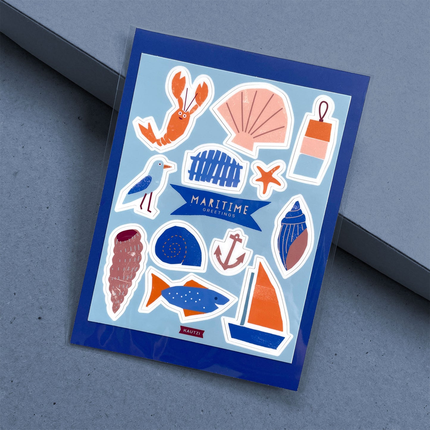 Sticker Sheet Maritimes featuring coastal icons in blue and orange - lobster, seashell, seagull, boats and maritime symbols