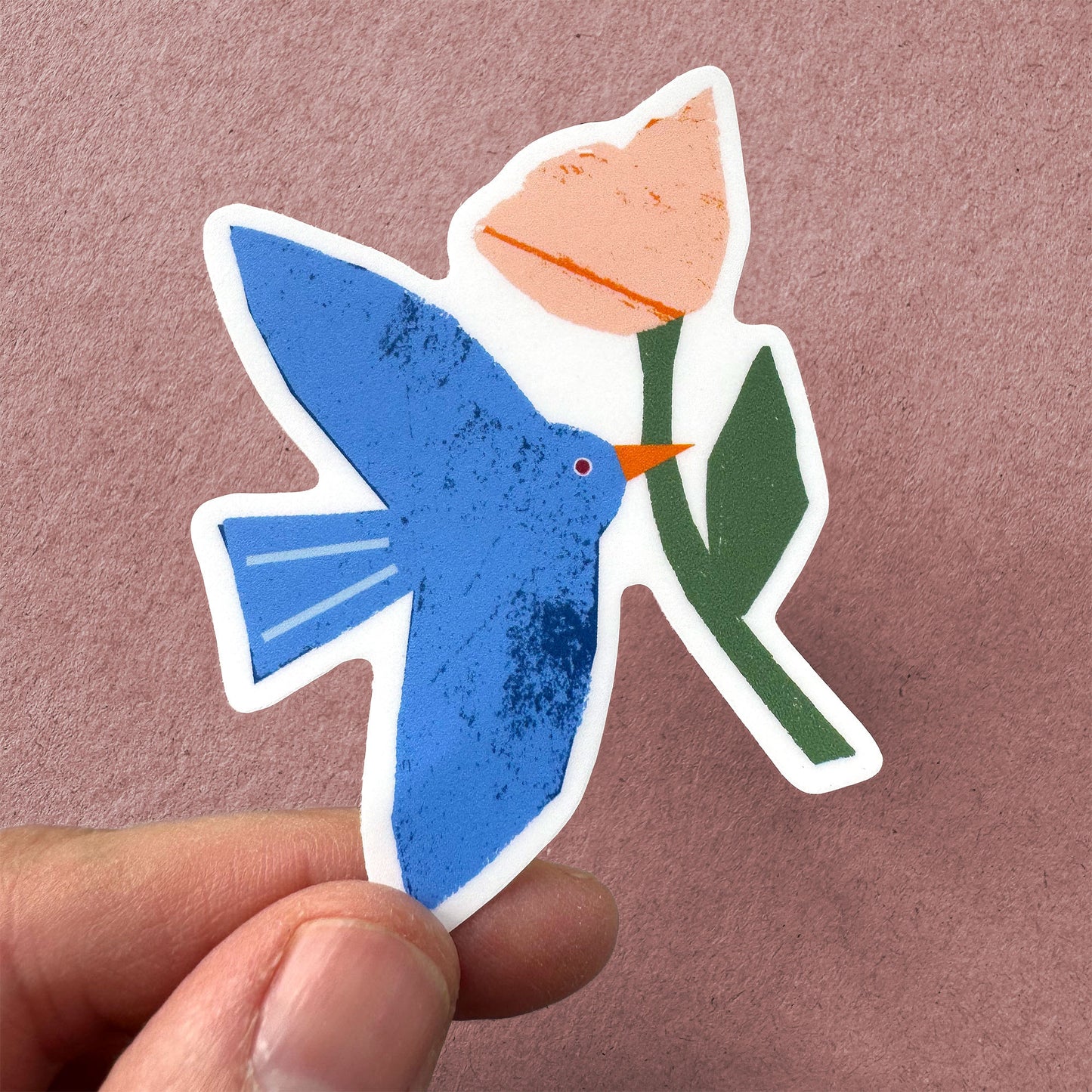 Sticker Bird - Whimsical blue bird carrying pink flower, textured vinyl design with white border
