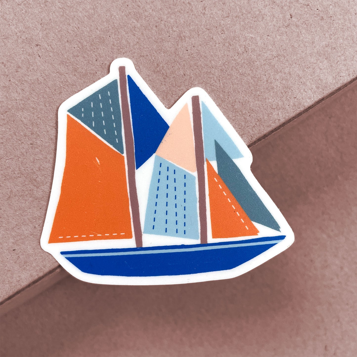 Stylized Bluenose sticker featuring geometric sailing ship design in orange, blue and light blue on white vinyl background