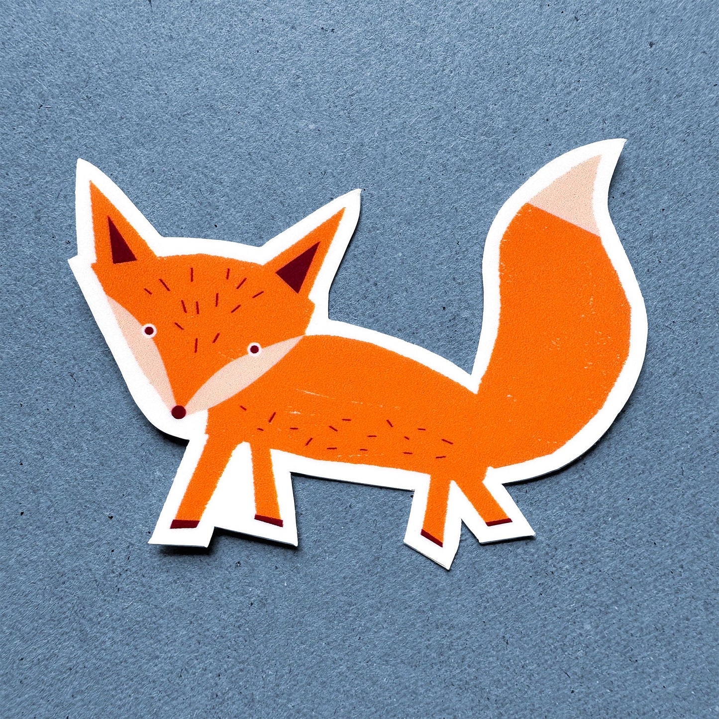 Sticker Fox - cute orange fox vinyl sticker with playful design and fluffy tail on blue background