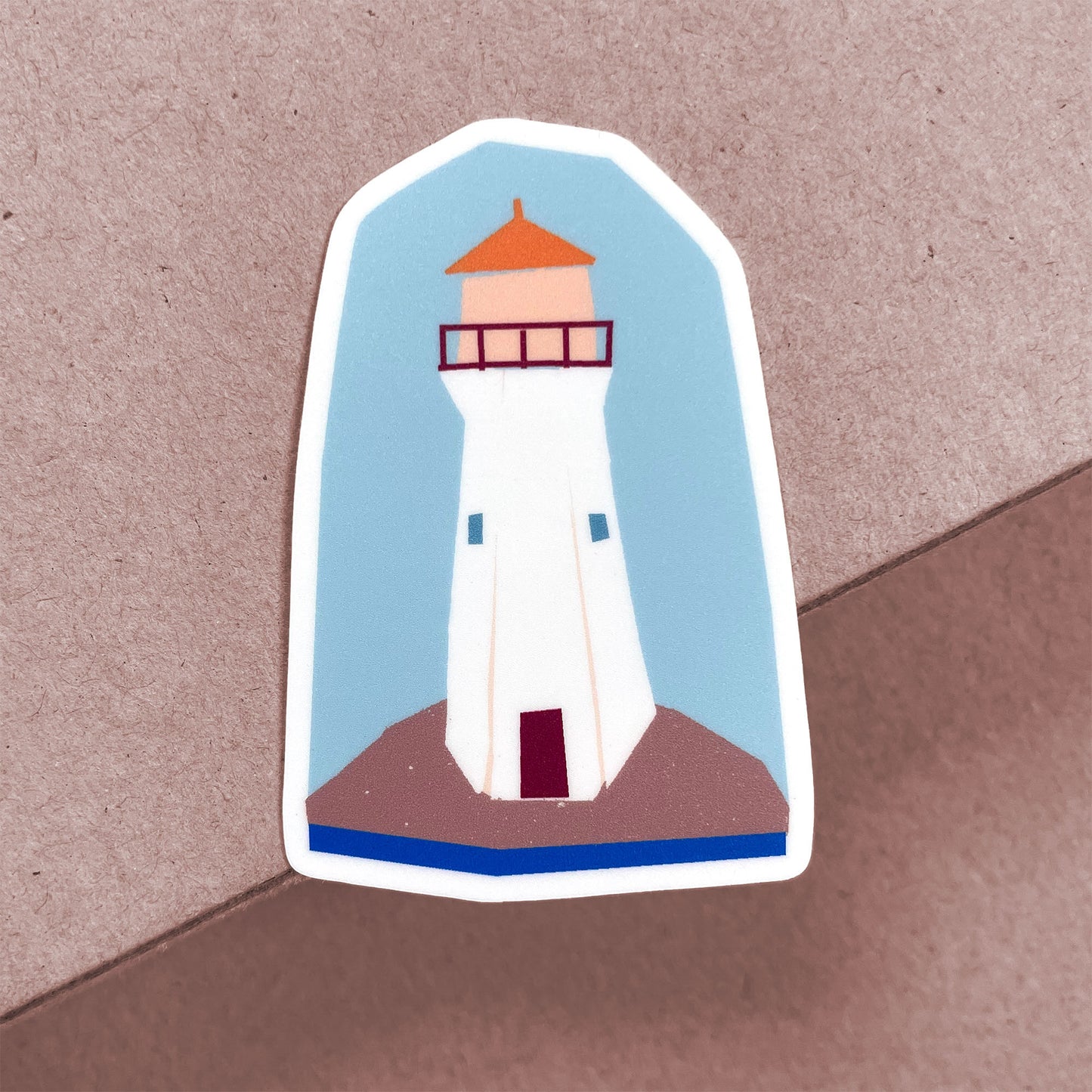 Lighthouse sticker featuring white coastal tower with orange roof against blue background on decorative vinyl cutout
