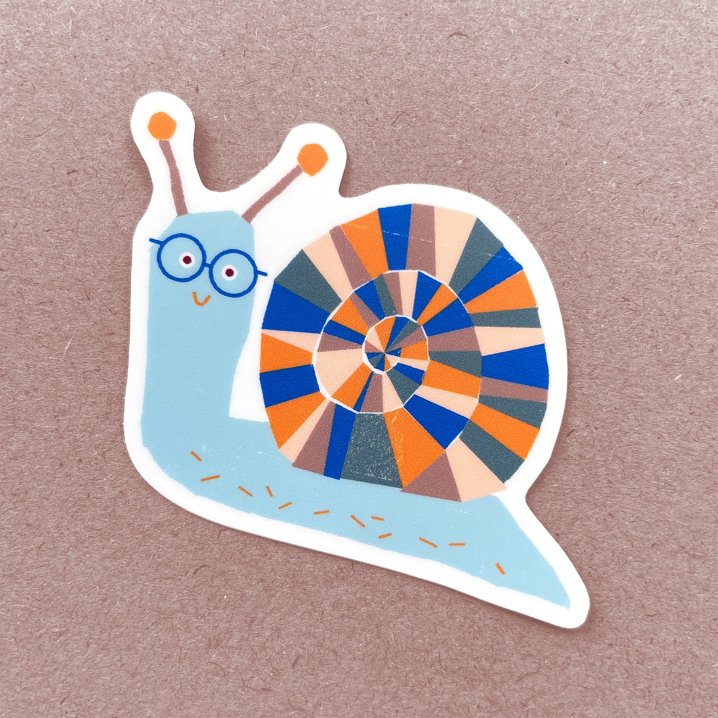 Sticker Snail with blue and orange geometric shell pattern and adorable round glasses, illustrated in a whimsical style