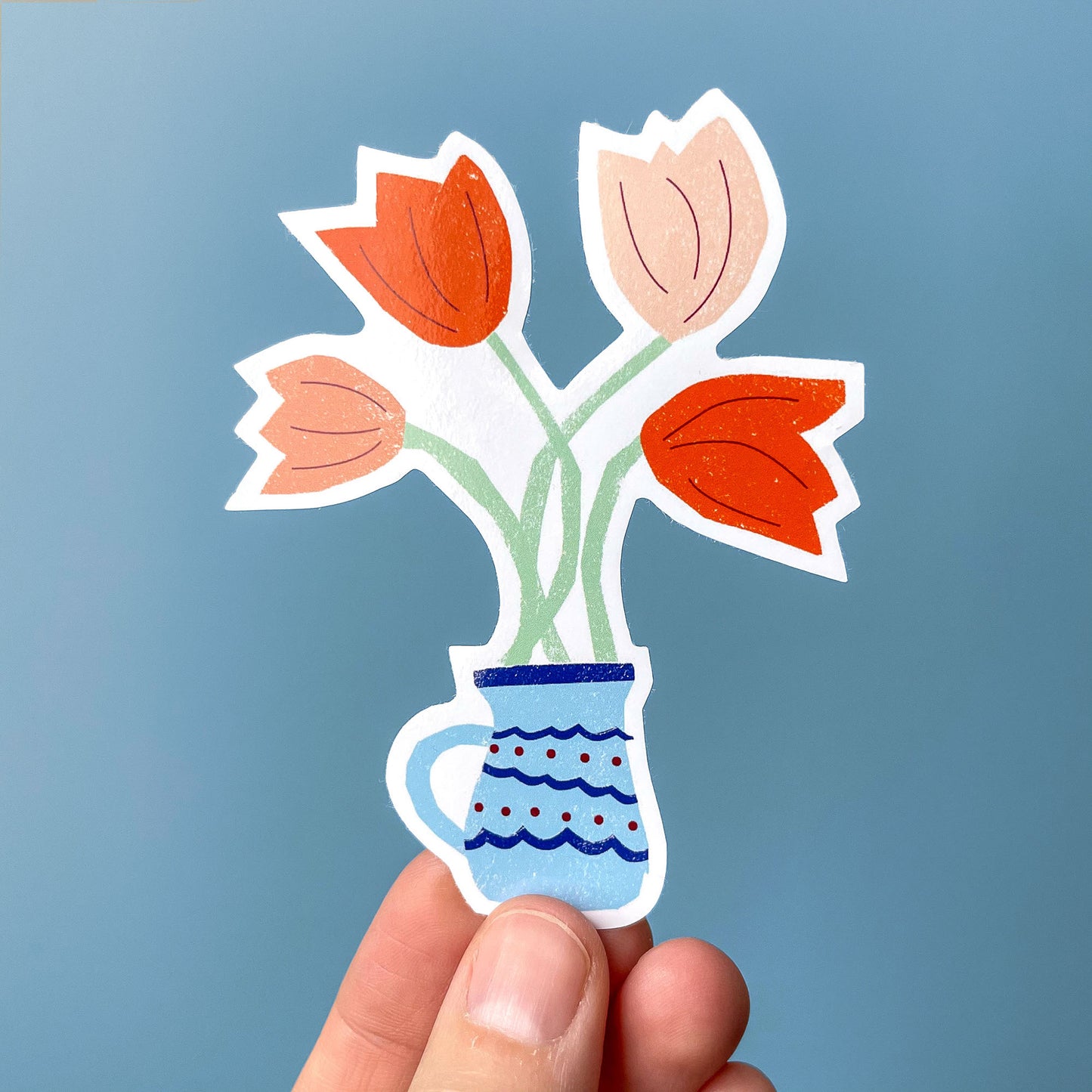 Sticker Tulips: Colorful tulip bouquet in blue patterned vase illustrated vinyl sticker on blue background