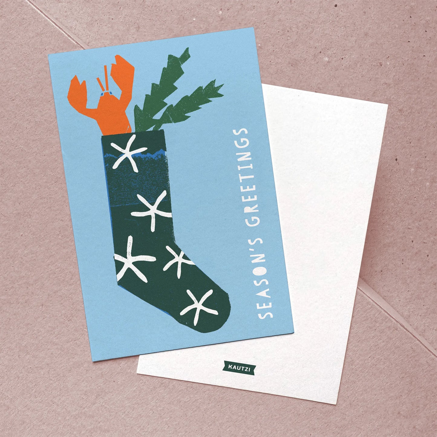 Front and back view of “Lobster Stocking” Christmas card with bold holiday illustration and simple logo.