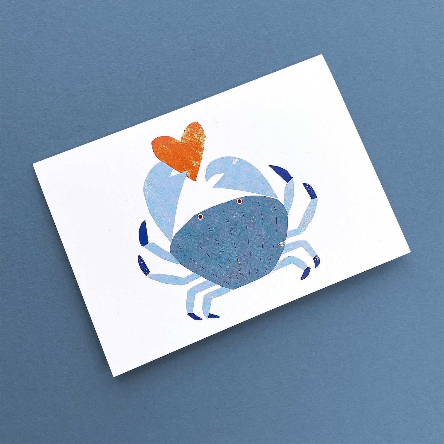 Kautzi crab greeting card, blue crab holding orange heart – Cape Breton, Nova Scotia love card.