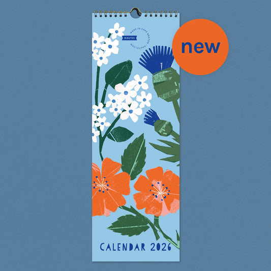 Front cover of the 2026 “Flowers of the Maritimes” wall calendar by Kautzi, featuring bold floral cut-paper illustrations including pale pink mayflowers, blue thistles, and red-orange wild roses on a light blue background. A bright orange “new” circle in the top right signals the recent launch of the calendar.