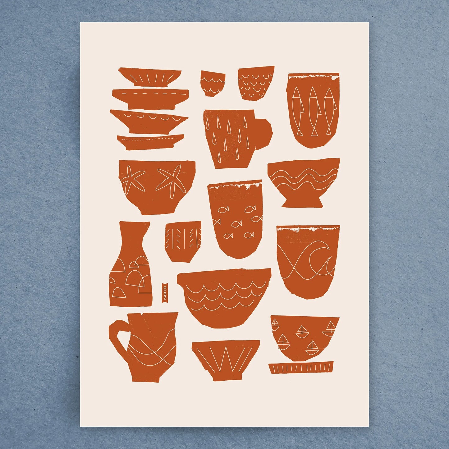 Flat lay of the Seaside Dishes tea towel by Kautzi, showcasing an abstract design of bowls, mugs, and sea-inspired motifs in warm terracotta on natural white cotton.