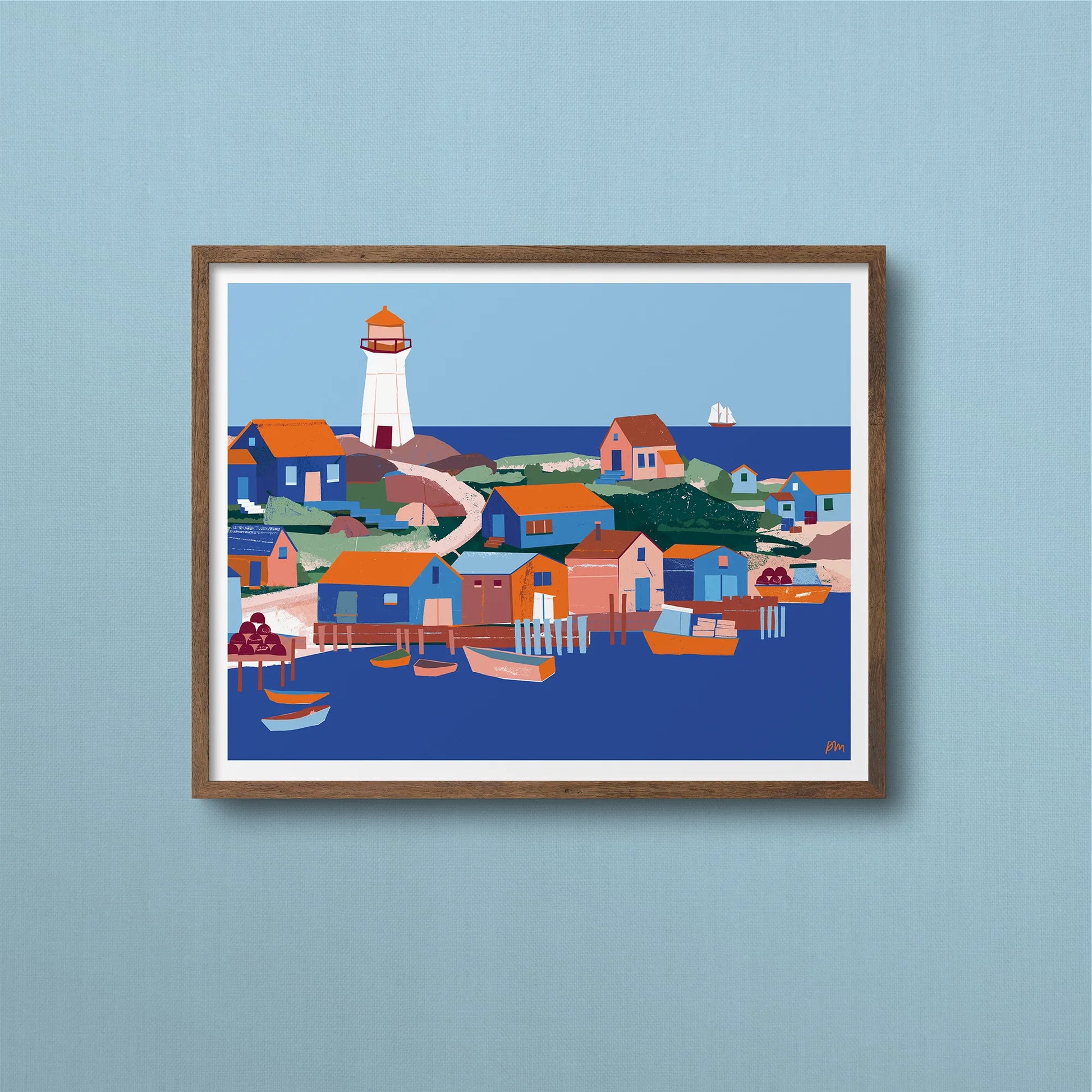 Kautzi Illustrations 11×14 Fishing Village art print displayed in a wooden frame against a textured wall, showing a bright coastal village scene with boats, houses, and a lighthouse inspired by the Maritimes, Canada.