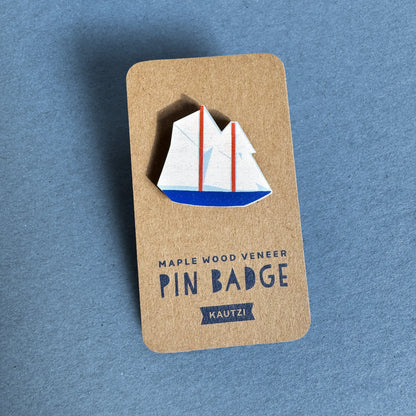 Kautzi maple wood veneer boat pin badge on kraft display backing, nautical design inspired by Nova Scotia’s iconic Bluenose schooner
