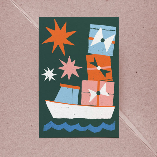 Flat Card – Christmas Cargo with playful gift-filled lobster boat and festive stars on textured cotton paper with Kraft envelope.