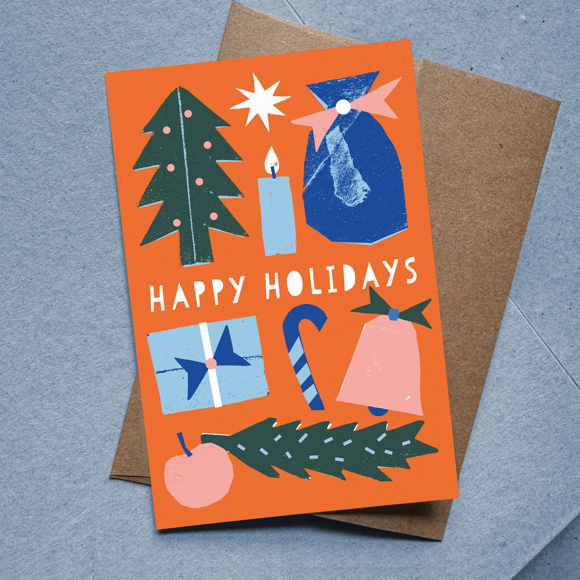 Flat Card – Happy Holidays with colorful holiday icons on orange background, kraft envelope included, designed by Kautzi.