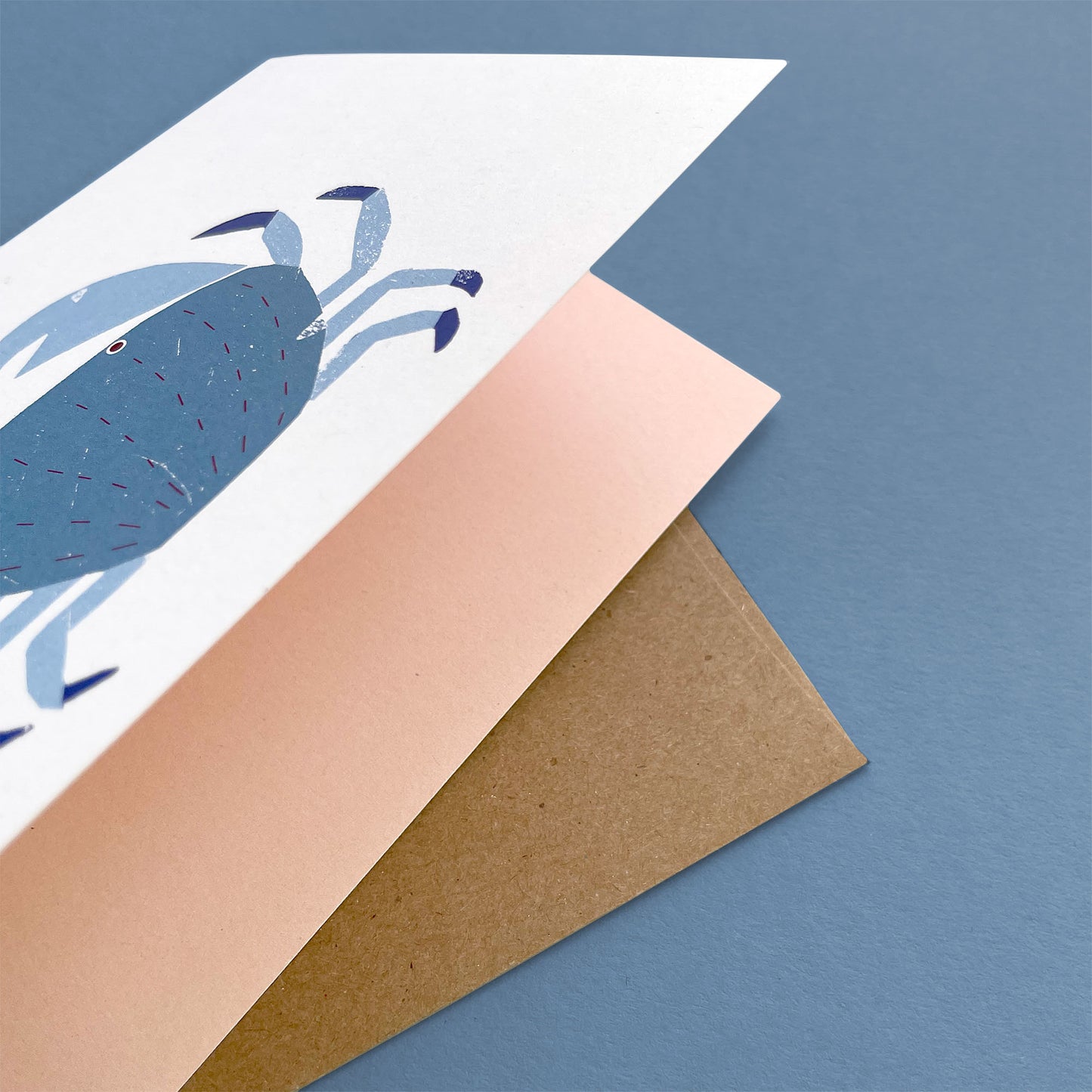 Kautzi crab greeting card, blue crab holding orange heart – Cape Breton, Nova Scotia love card.