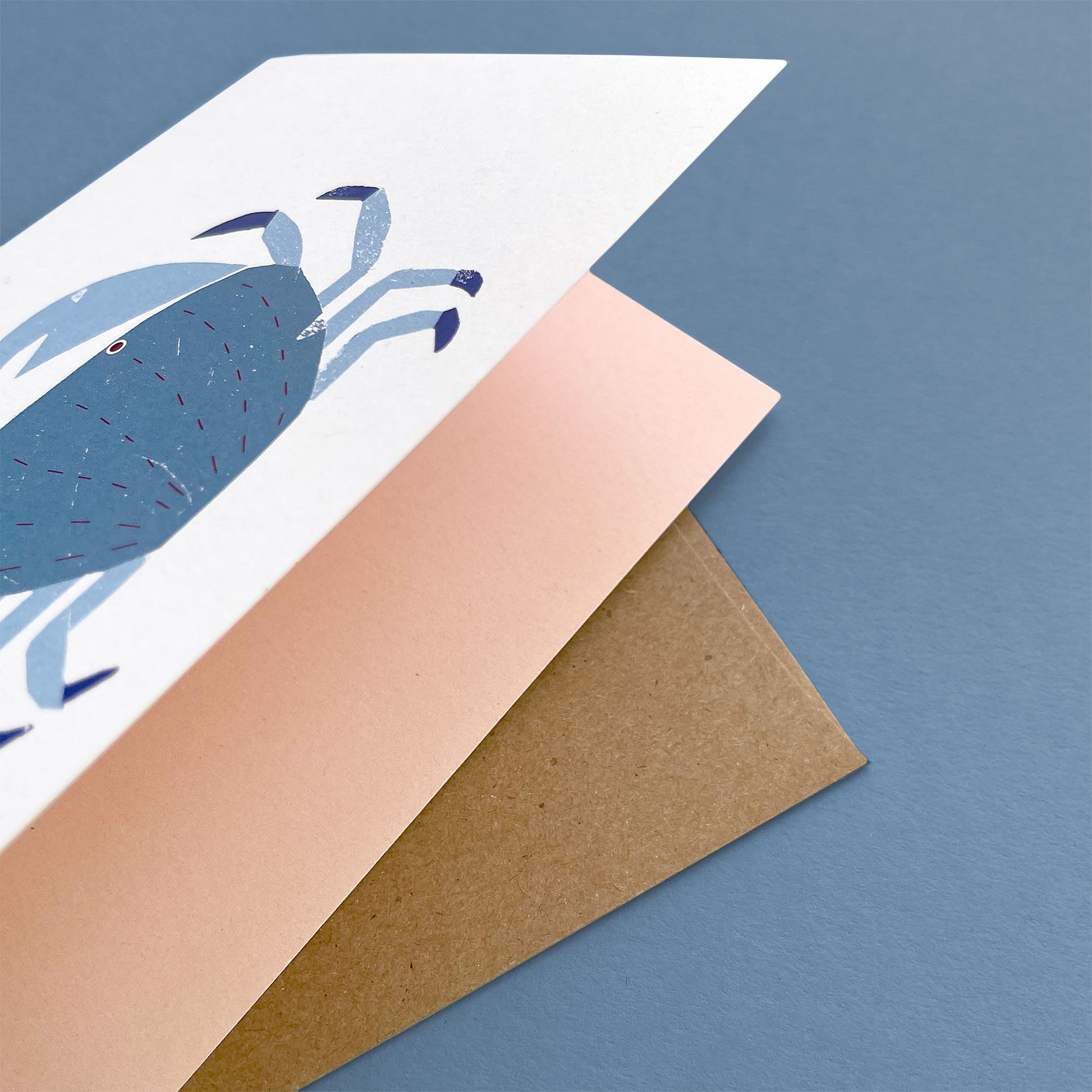 Kautzi crab greeting card, blue crab holding orange heart – Cape Breton, Nova Scotia love card.