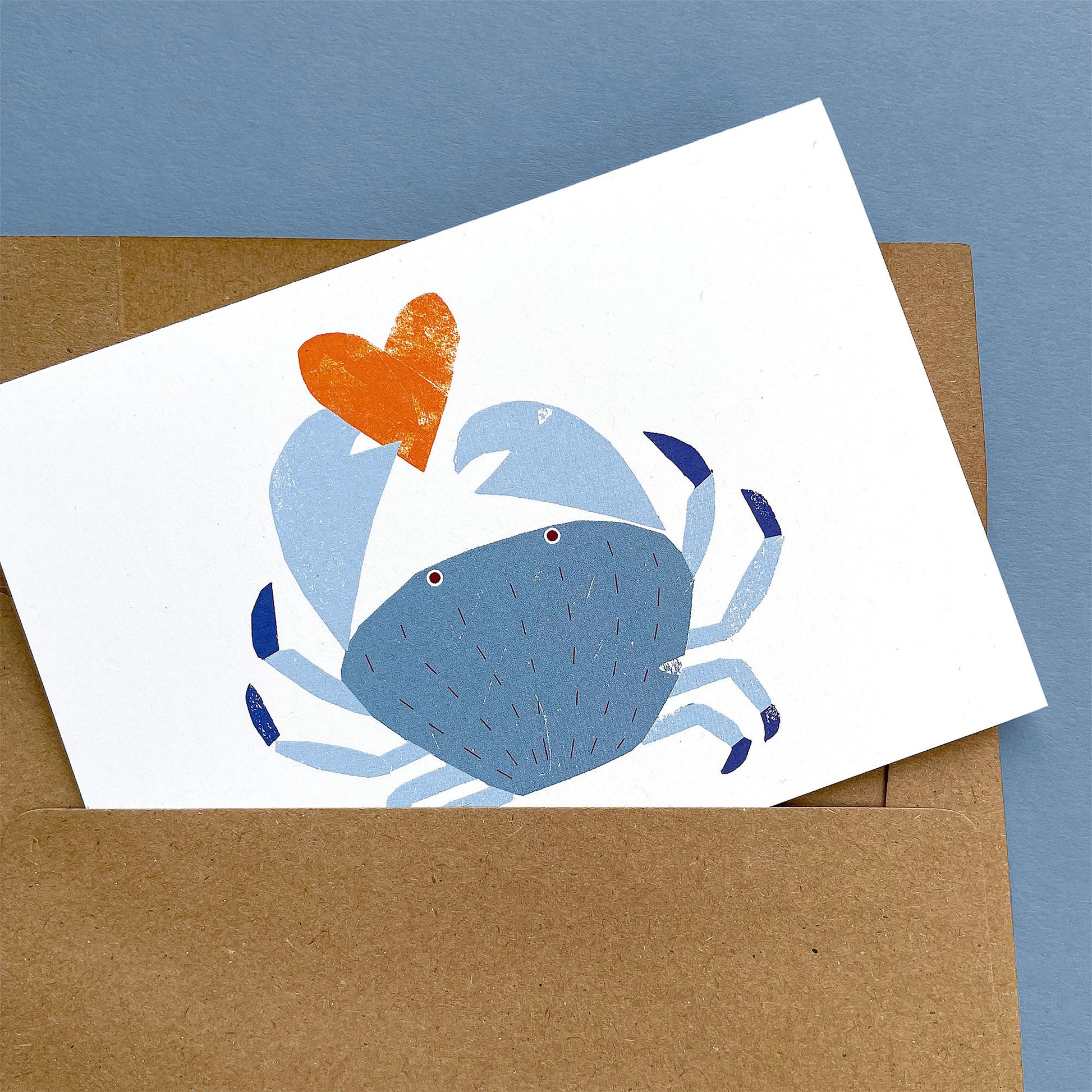 Kautzi crab greeting card, blue crab holding orange heart – Cape Breton, Nova Scotia love card.