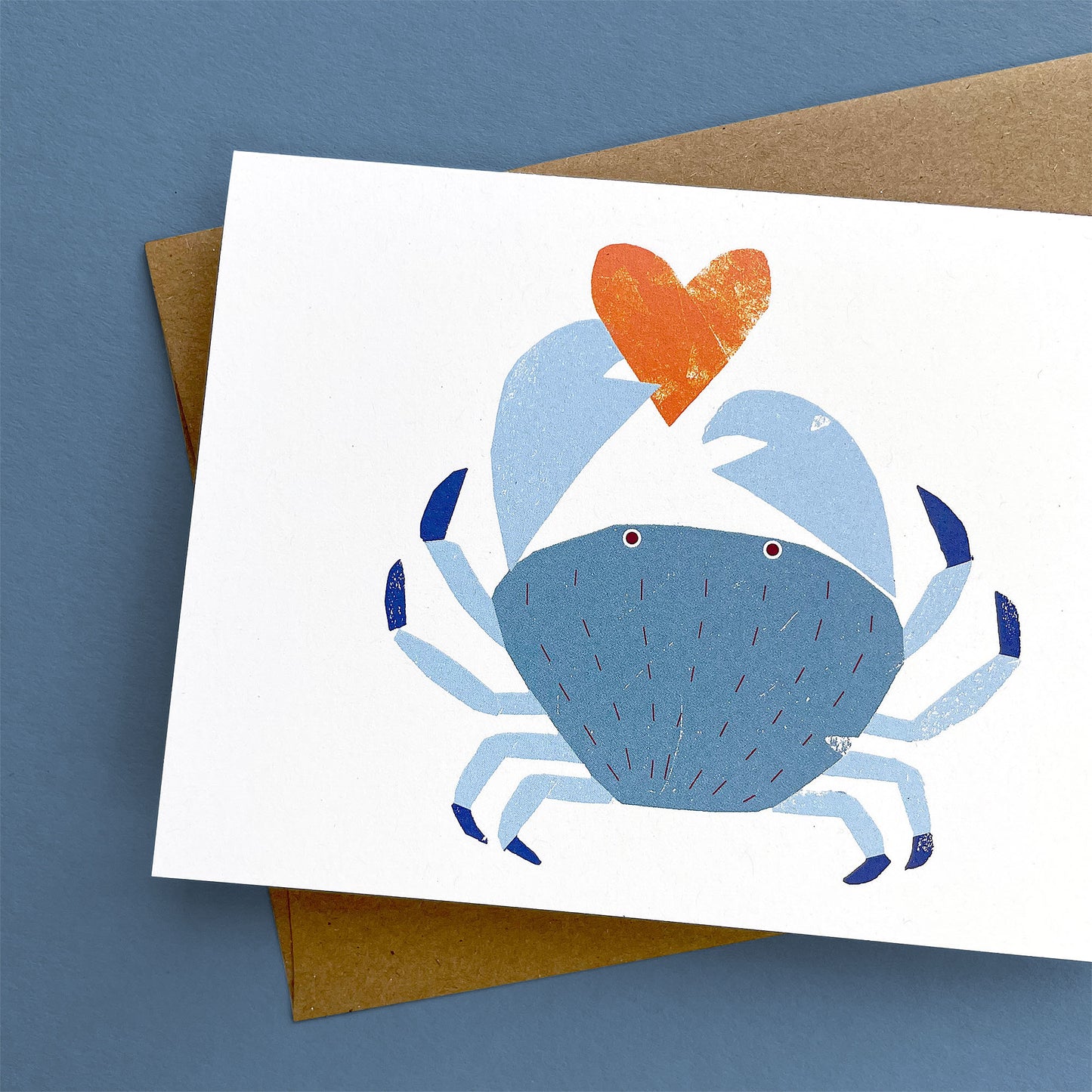 Kautzi crab greeting card, blue crab holding orange heart – Cape Breton, Nova Scotia love card.