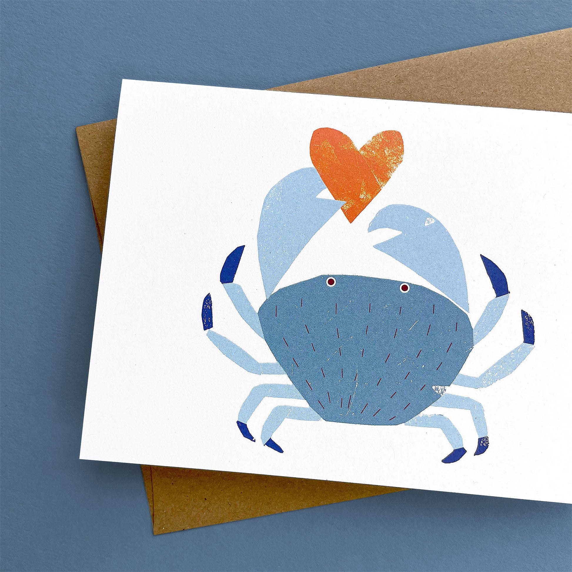 Kautzi crab greeting card, blue crab holding orange heart – Cape Breton, Nova Scotia love card.
