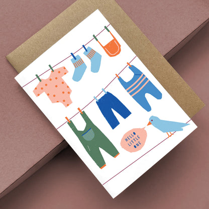 Kautzi Hello Little One baby card, illustrated baby clothes on clothesline – Cape Breton, Nova Scotia.