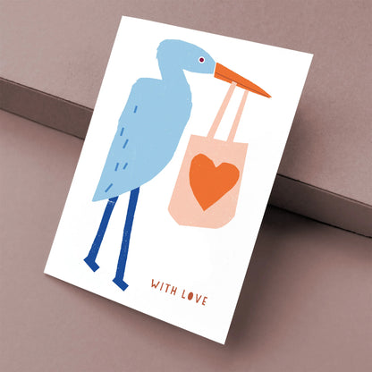 Kautzi with love greeting card featuring heron holding bag with heart, modern illustrated design, Cape Breton, Nova Scotia, Canada