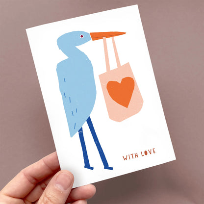 Kautzi with love greeting card featuring heron illustration held in hand, simple graphic design, Cape Breton, Nova Scotia, Canada