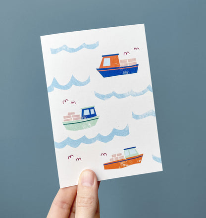 Kautzi lobster boats card with handheld – Nova Scotia coastal design.