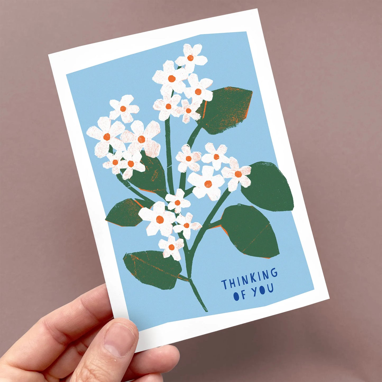 Kautzi thinking of you greeting card with mayflower illustration held in hand, calm floral design, Cape Breton, Nova Scotia, Canada