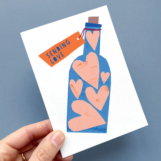 Kautzi Sending Love greeting card, blue bottle with pink hearts – Nova Scotia illustrated love card on recycled paper.