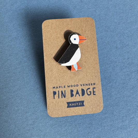 Kautzi maple wood veneer puffin pin badge on kraft display backing, inspired by Atlantic puffins of the Maritimes