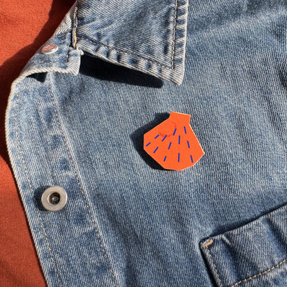 Kautzi maple wood veneer shell pin badge attached to denim jacket, Maritime beachcomber style