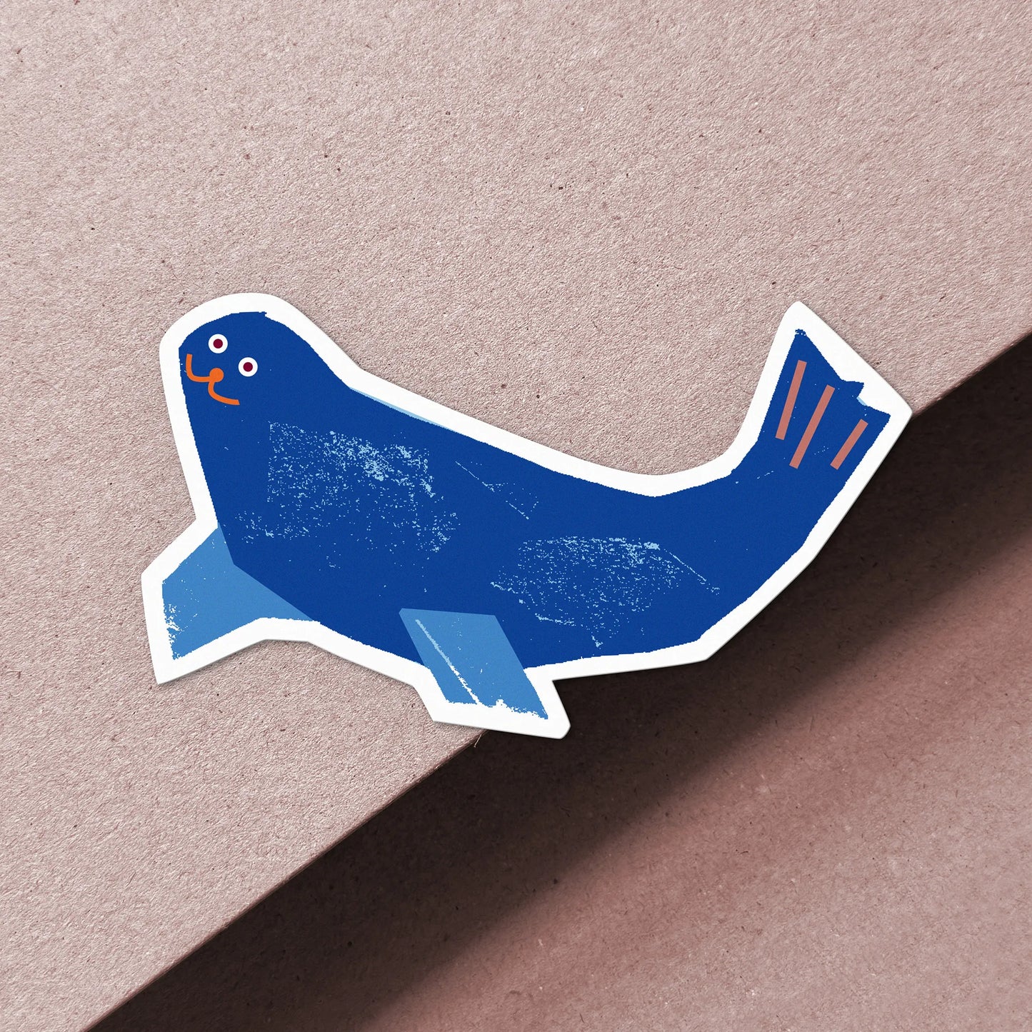 Kautzi blue seal vinyl sticker with orange details, weatherproof matte finish, designed in Cape Breton Canada