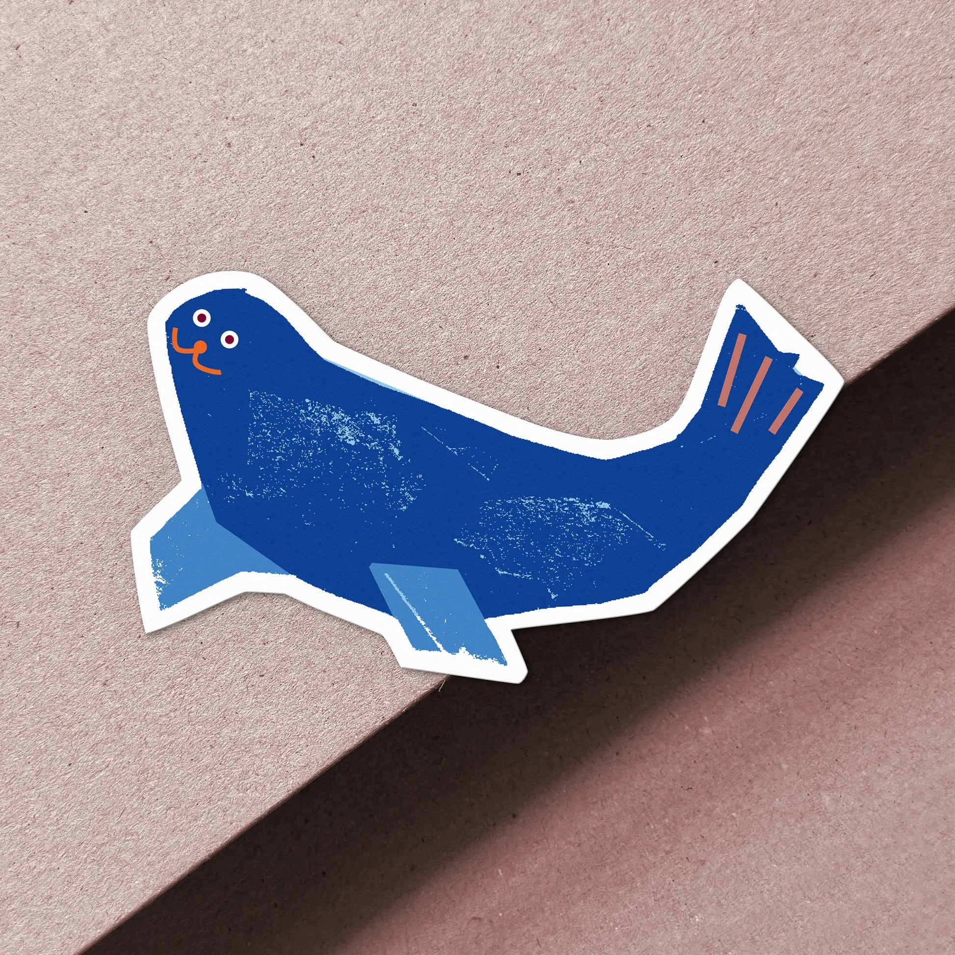 Kautzi blue seal vinyl sticker with orange details, weatherproof matte finish, designed in Cape Breton Canada