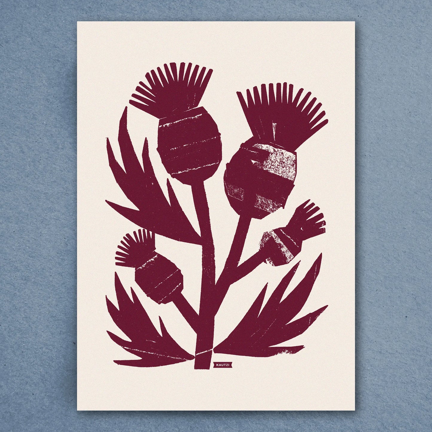 Kautzi Wild Thistles illustration in deep plum inspired by Atlantic Canadian flora, shown flat against a blue background.