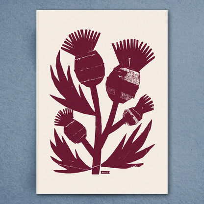 Kautzi Wild Thistles illustration in deep plum inspired by Atlantic Canadian flora, shown flat against a blue background.