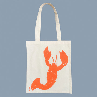 Kautzi lobster tote bag screen-printed in bright orange on natural cotton, flat view, Cape Breton, Nova Scotia, Canada.