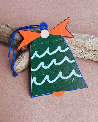 Kautzi green wooden bell ornament with wave pattern and orange bow, designed in Cape Breton, Nova Scotia.