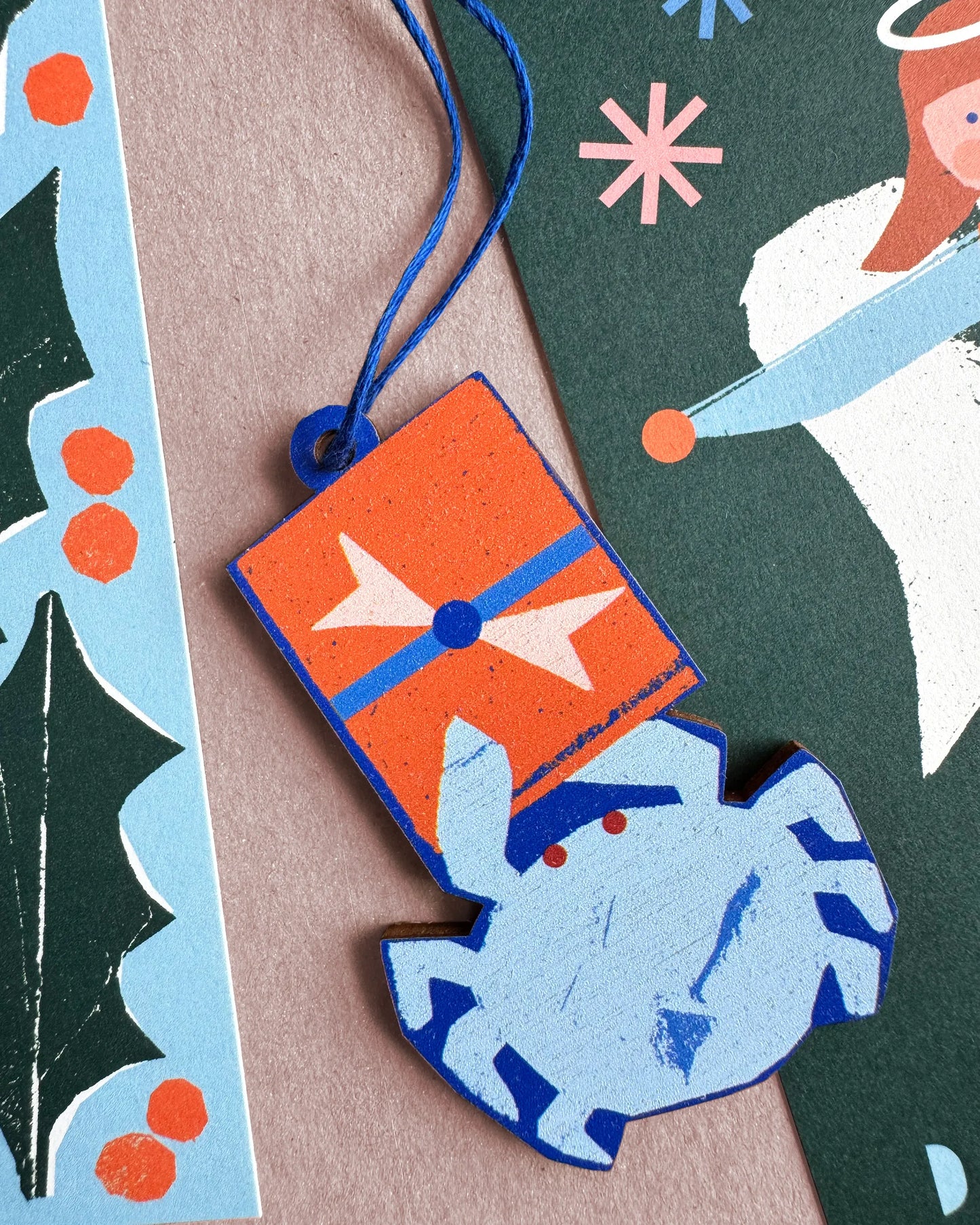 Kautzi crab ornament alongside Maritime-inspired holiday cards in bright coastal colours.
