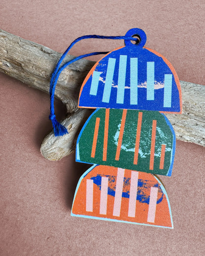 Kautzi wooden ornament featuring three stacked lobster traps in blue, green, and orange, designed in Cape Breton, Nova Scotia.