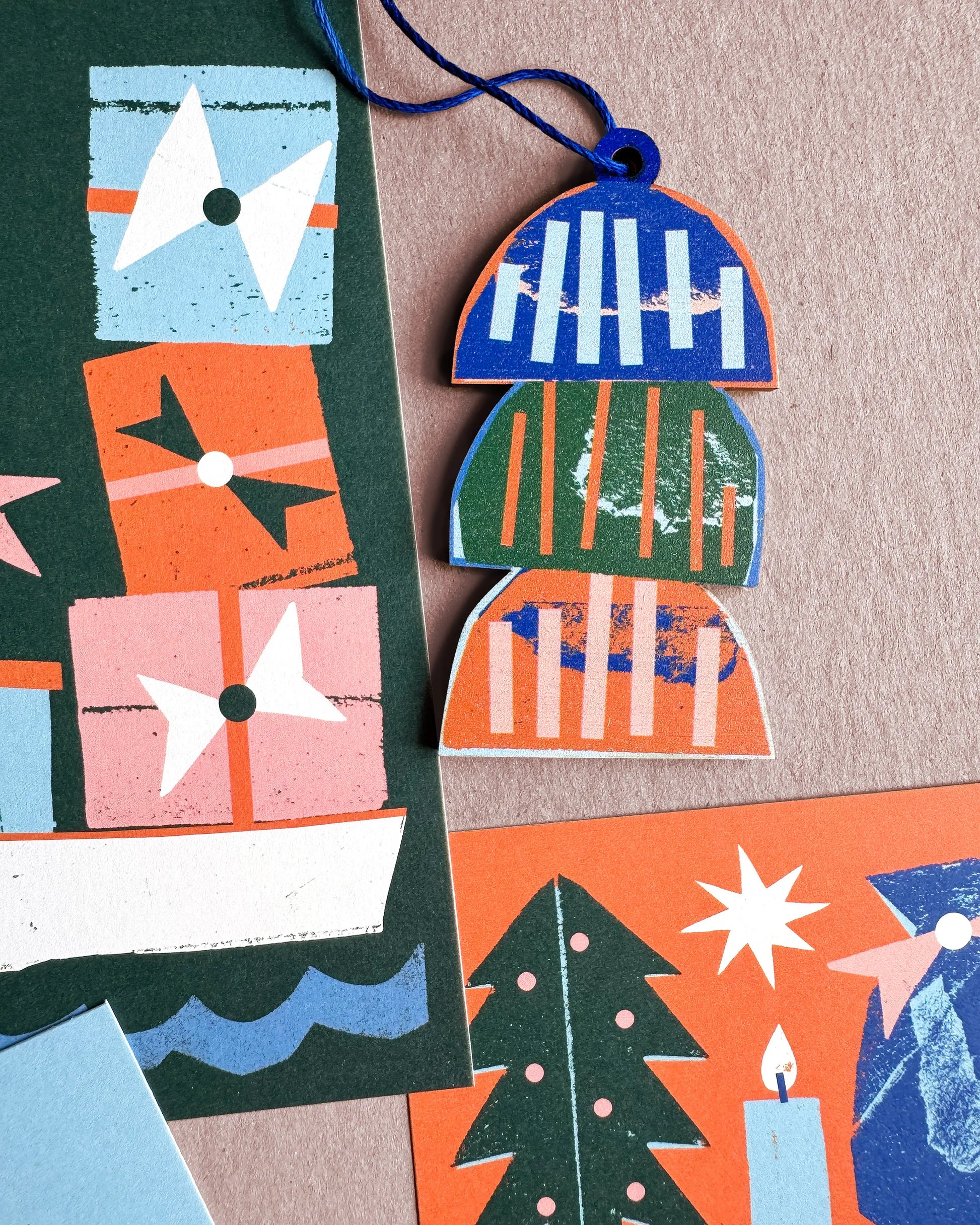 Kautzi East Coast lobster trap ornament displayed with colourful Christmas cards featuring maritime motifs.